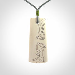 Hand carved bone toki pendant