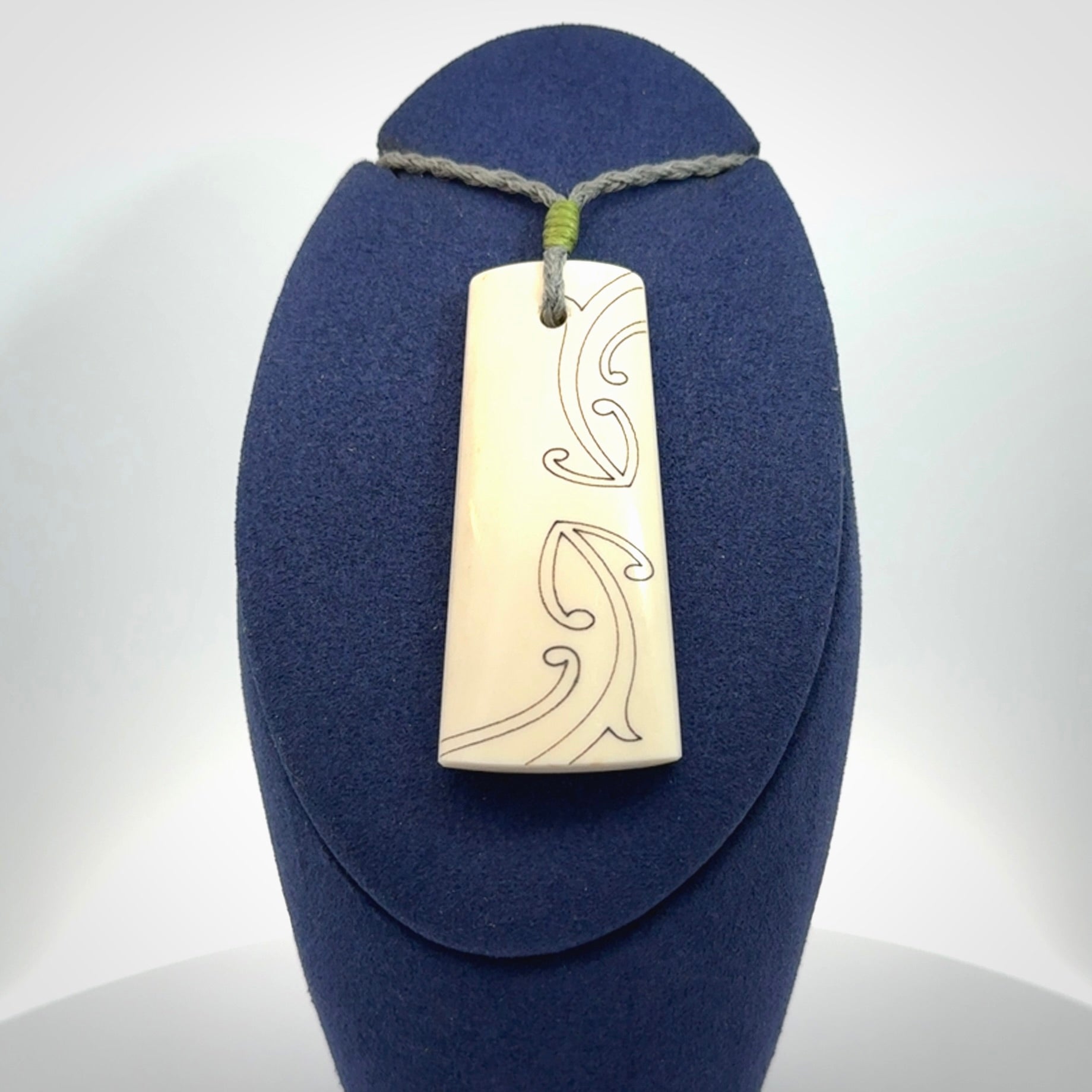 Hand carved bone toki pendant