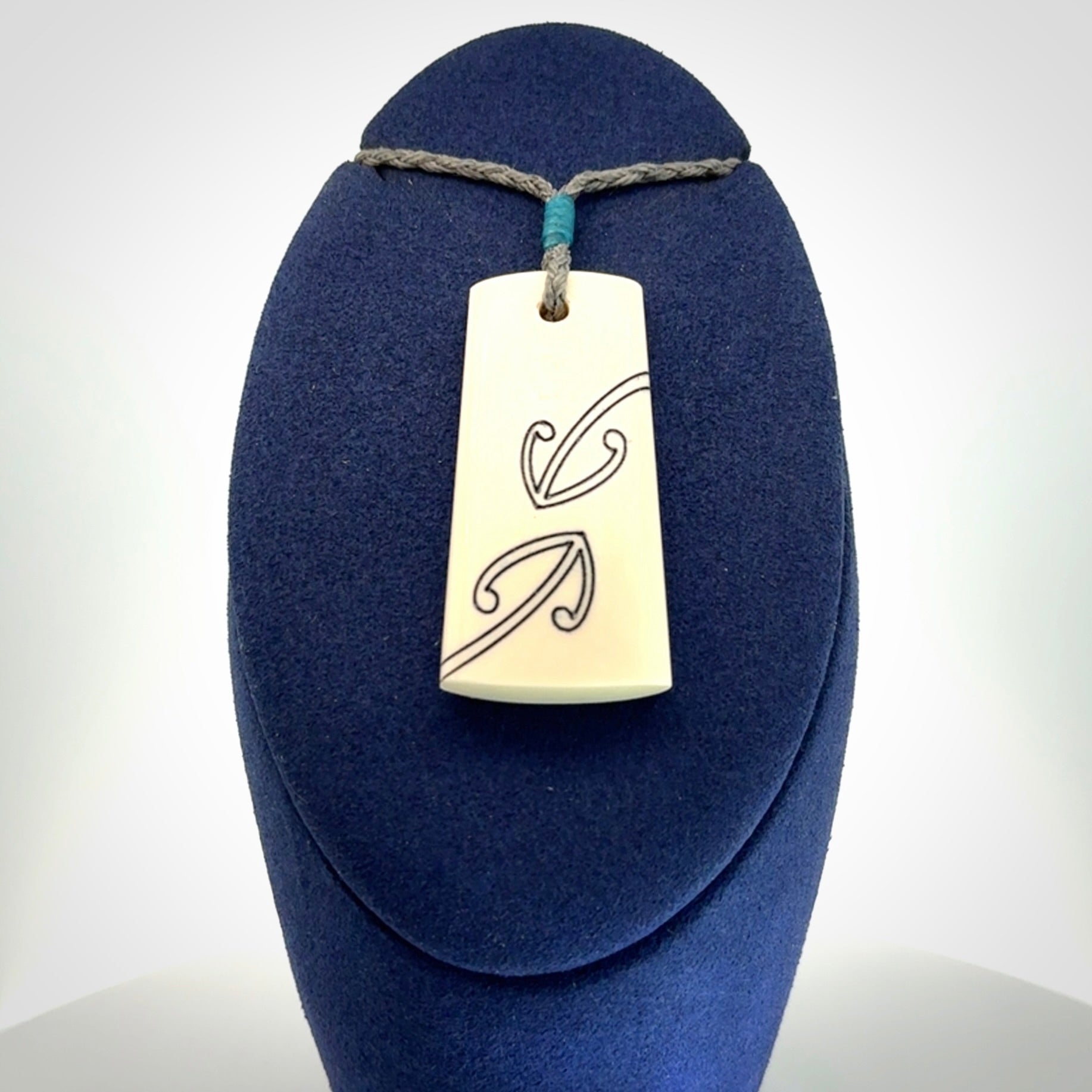 Hand carved bone toki pendant