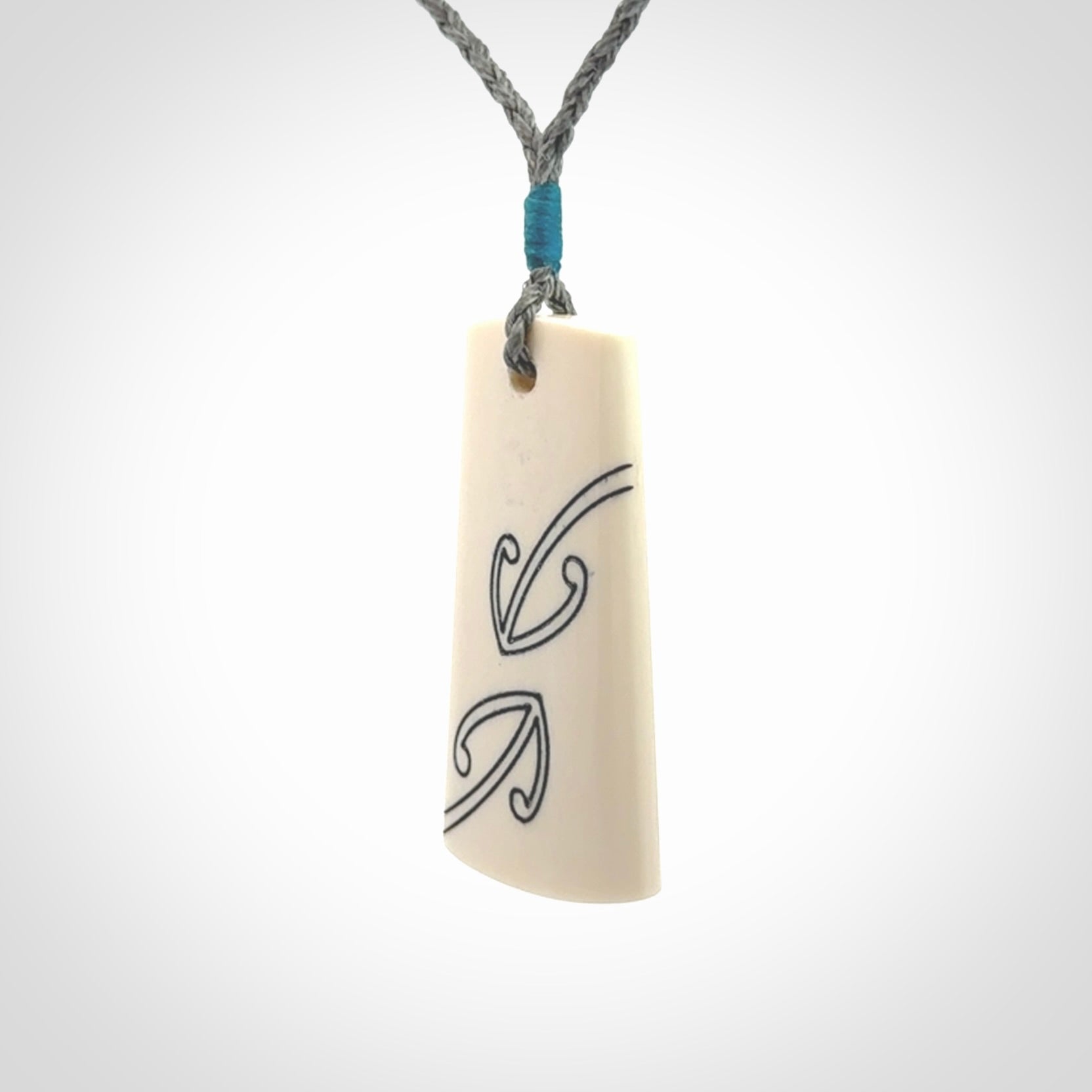 Hand carved bone toki pendant