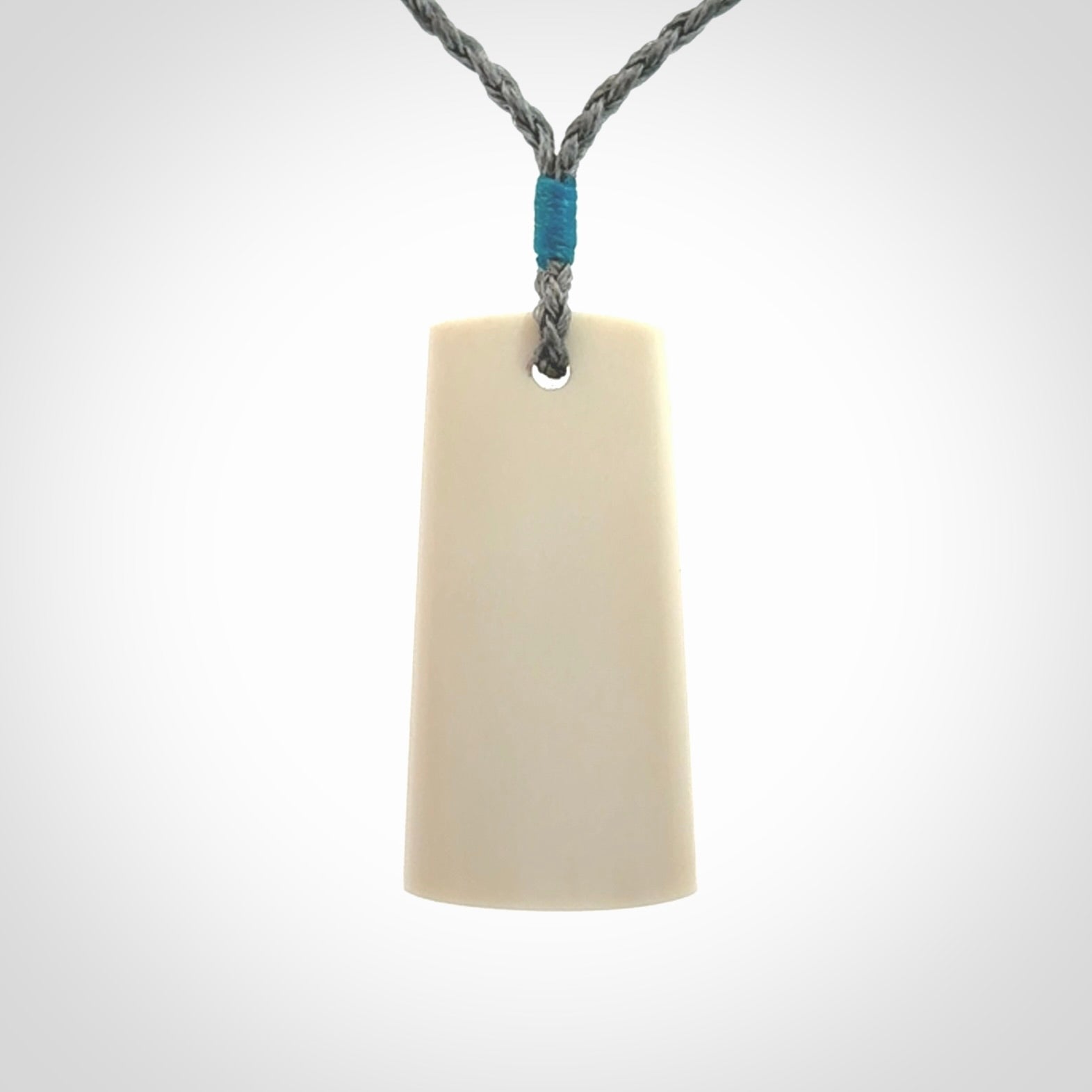 Hand carved bone toki pendant