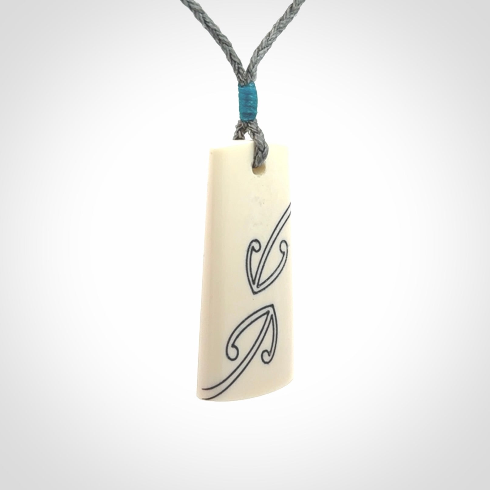 Hand carved bone toki pendant