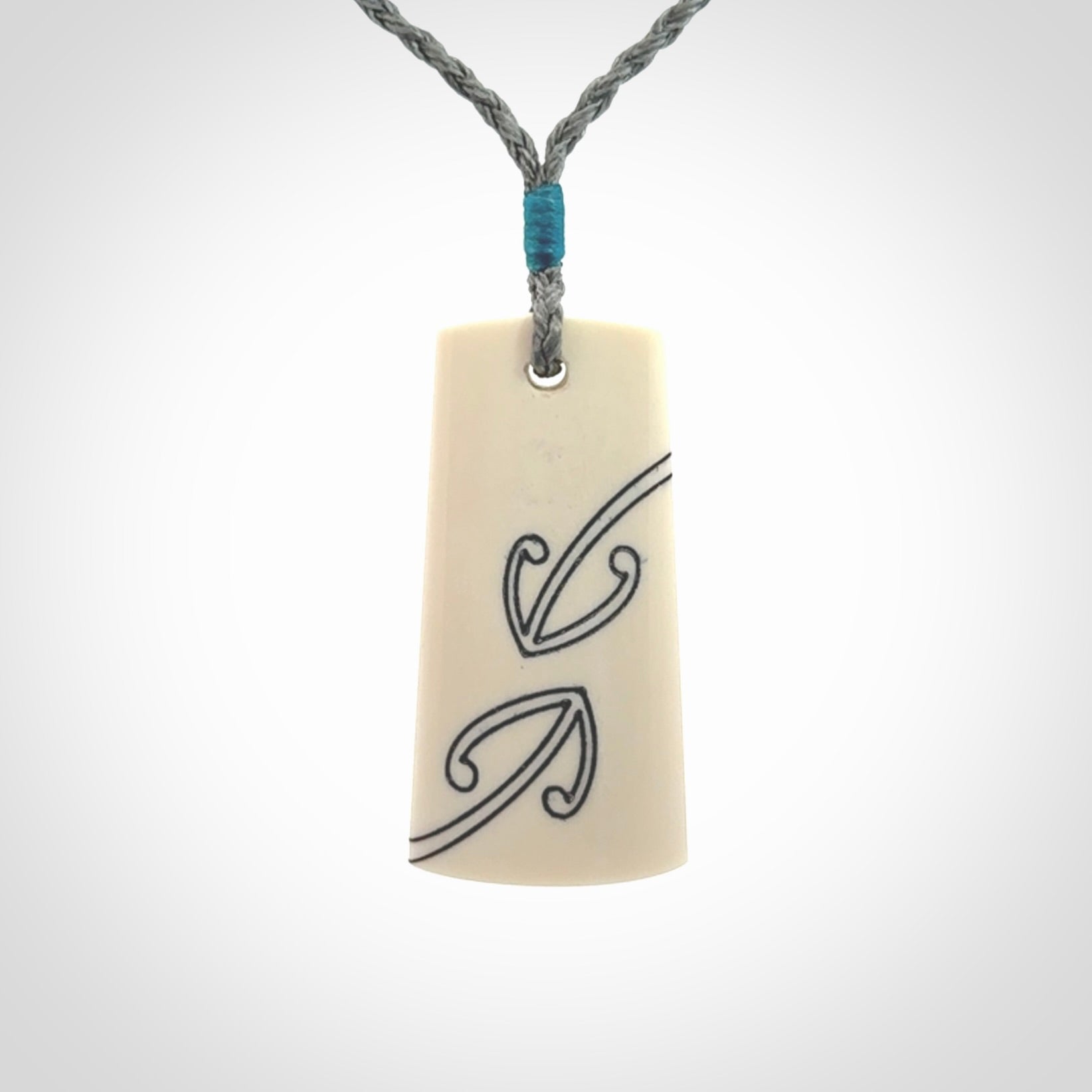 Hand carved bone toki pendant