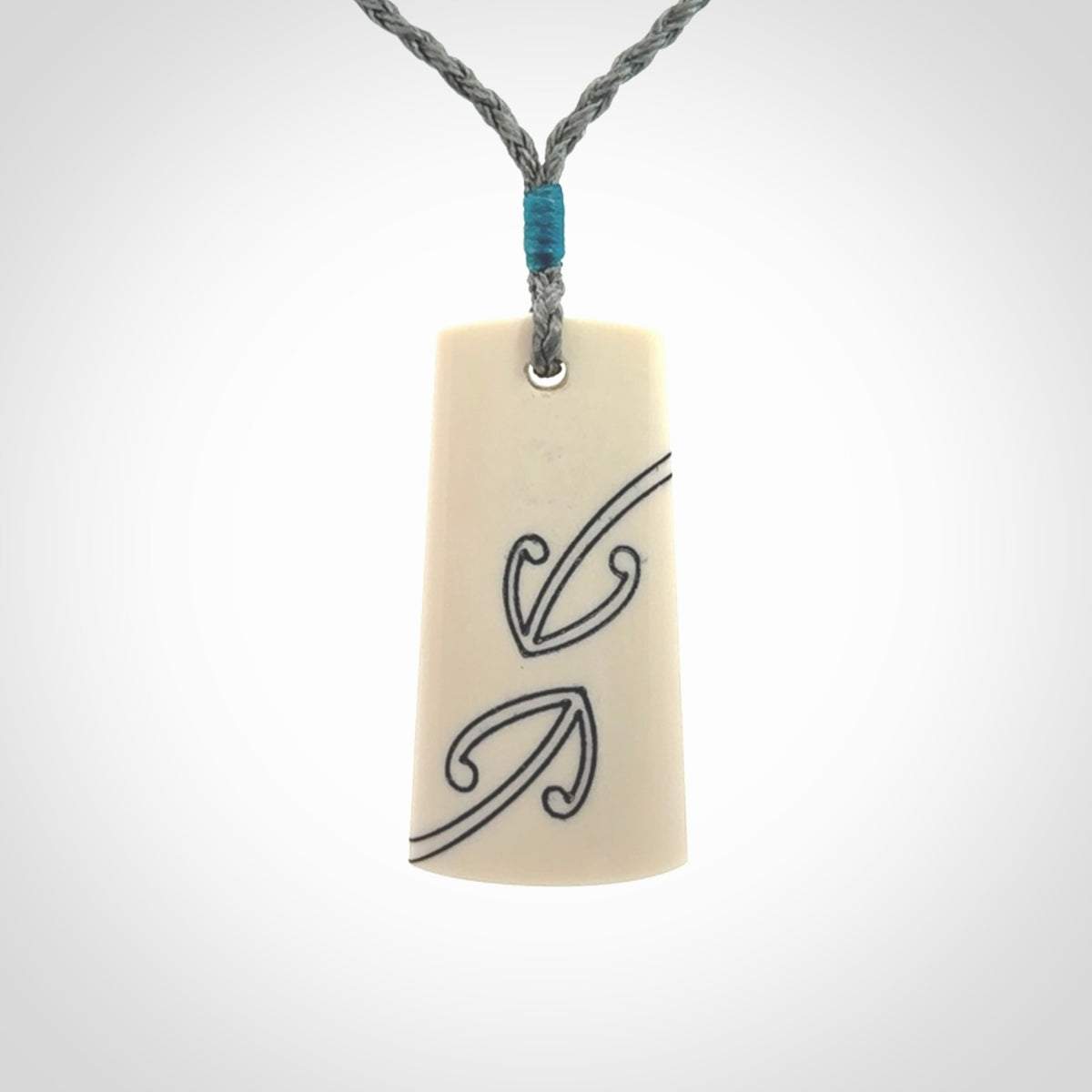 Hand carved bone toki pendant