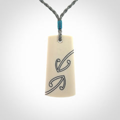 Hand carved bone toki pendant