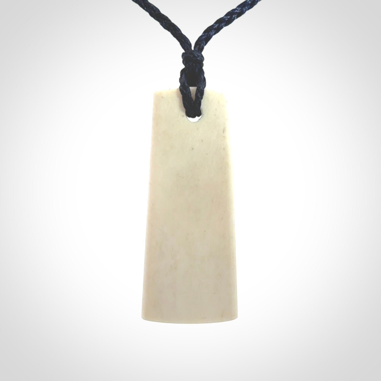 Hand carved bone toki pendant