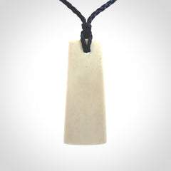 Hand carved bone toki pendant