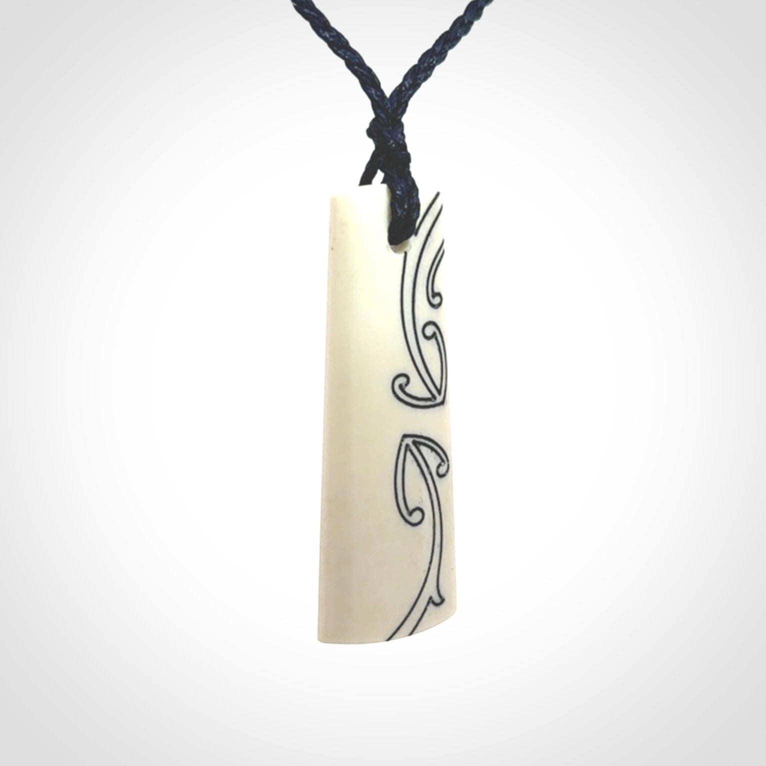Hand carved bone toki pendant