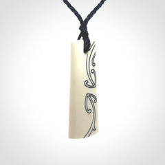 Hand carved bone toki pendant