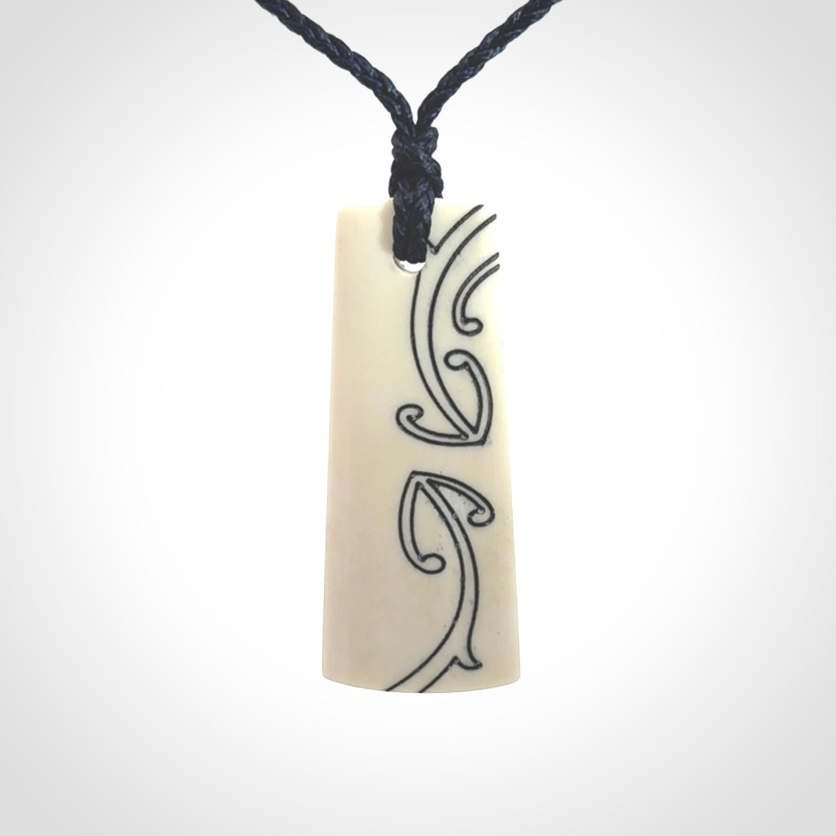 Hand carved bone toki pendant