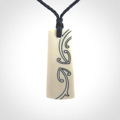 Hand carved bone toki pendant