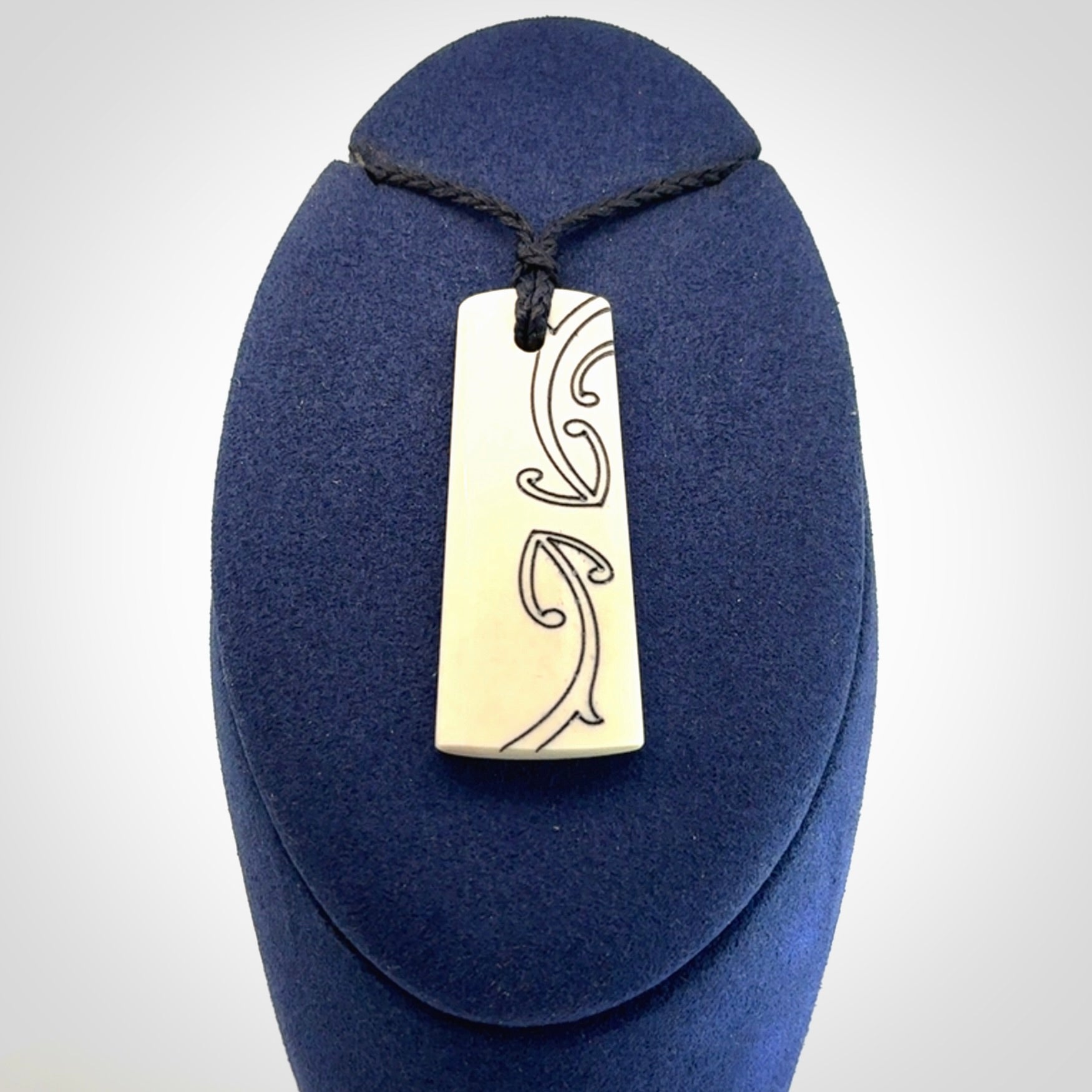 Hand carved bone toki pendant