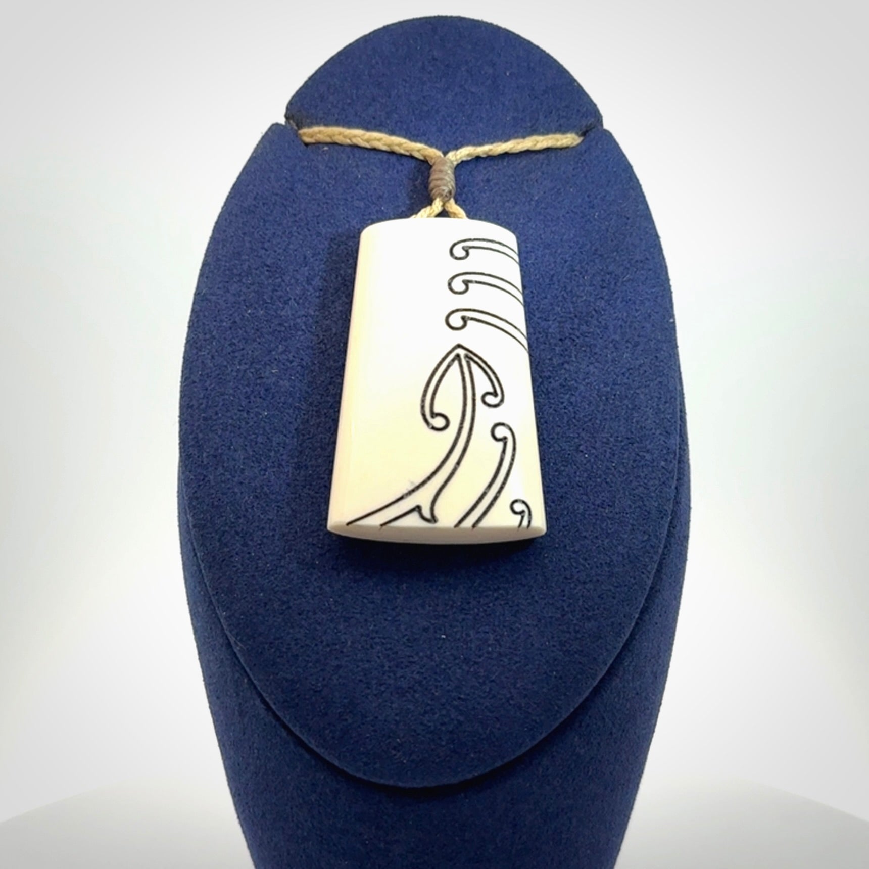 Hand carved bone toki pendant