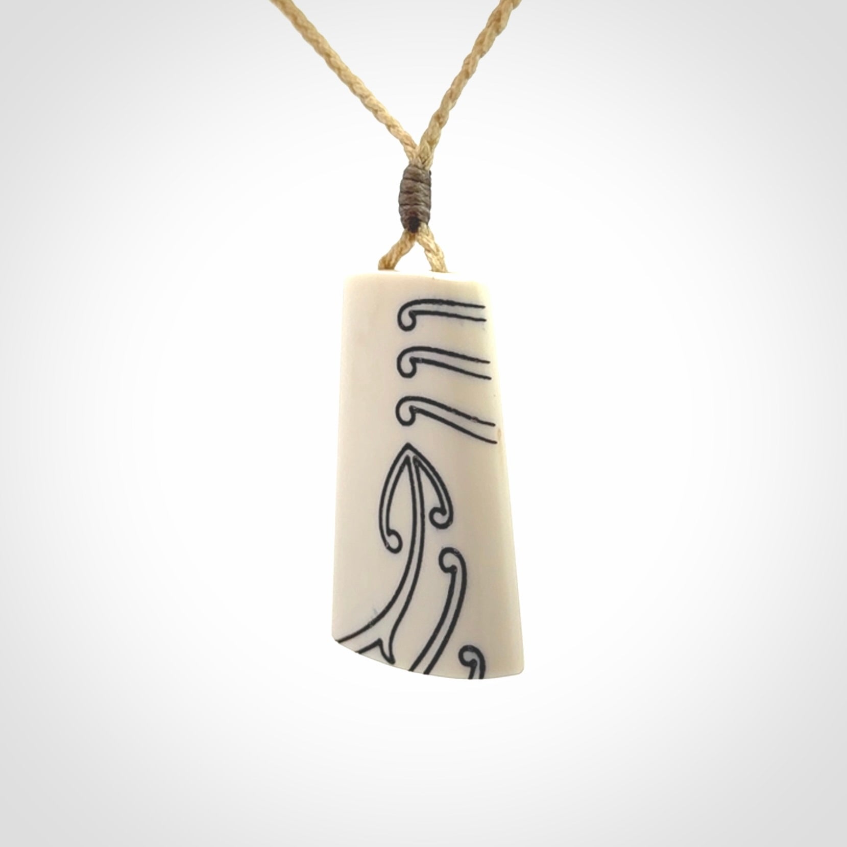 Hand carved bone toki pendant