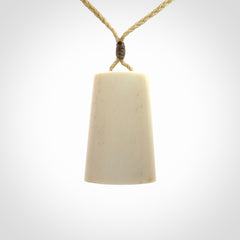 Hand carved bone toki pendant