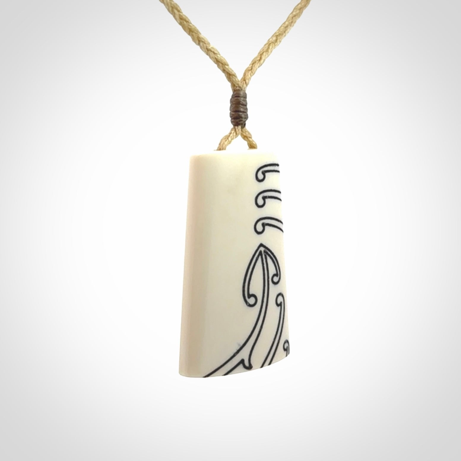 Hand carved bone toki pendant