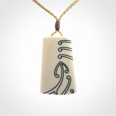Hand carved bone toki pendant