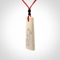 Hand carved bone toki pendant