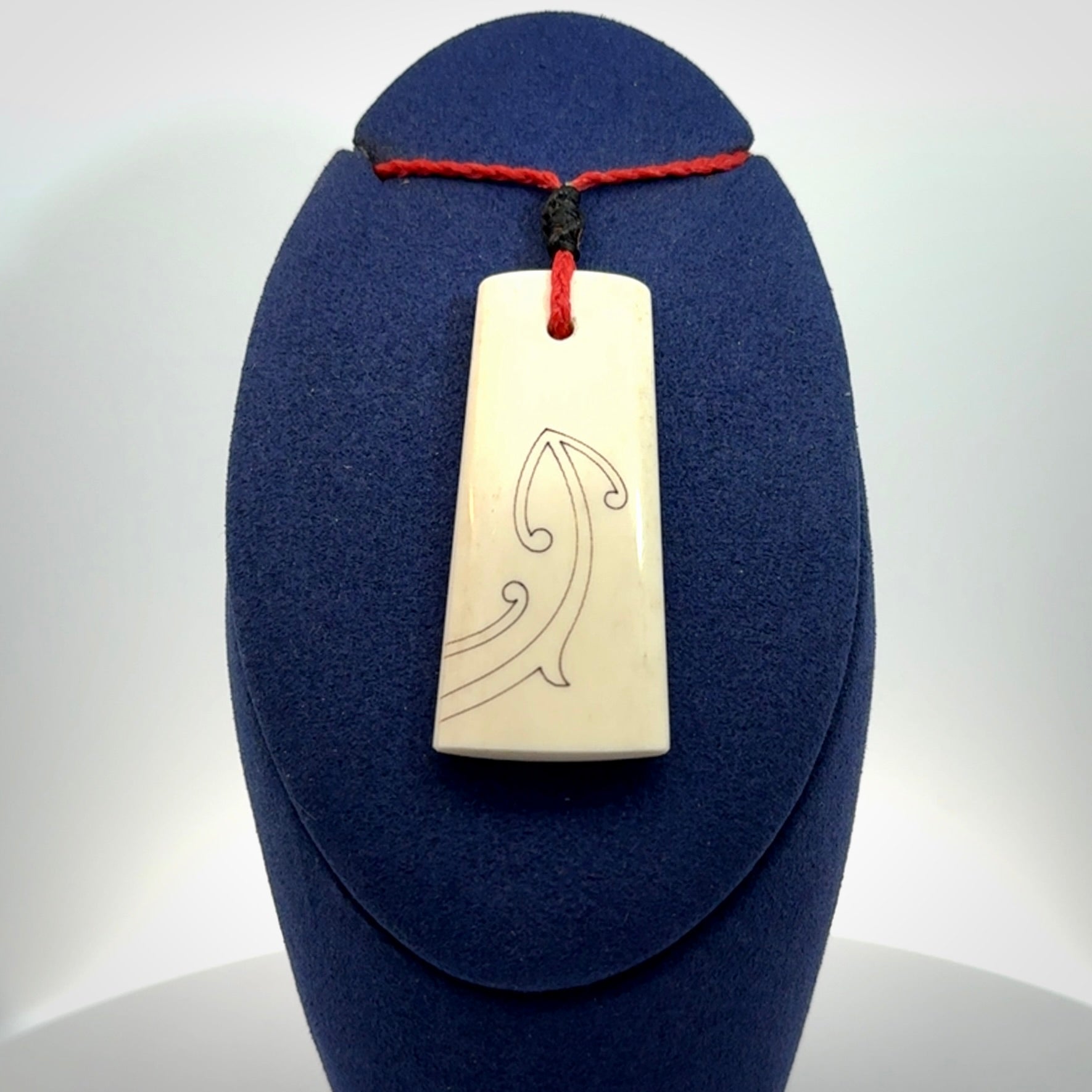 Hand carved bone toki pendant