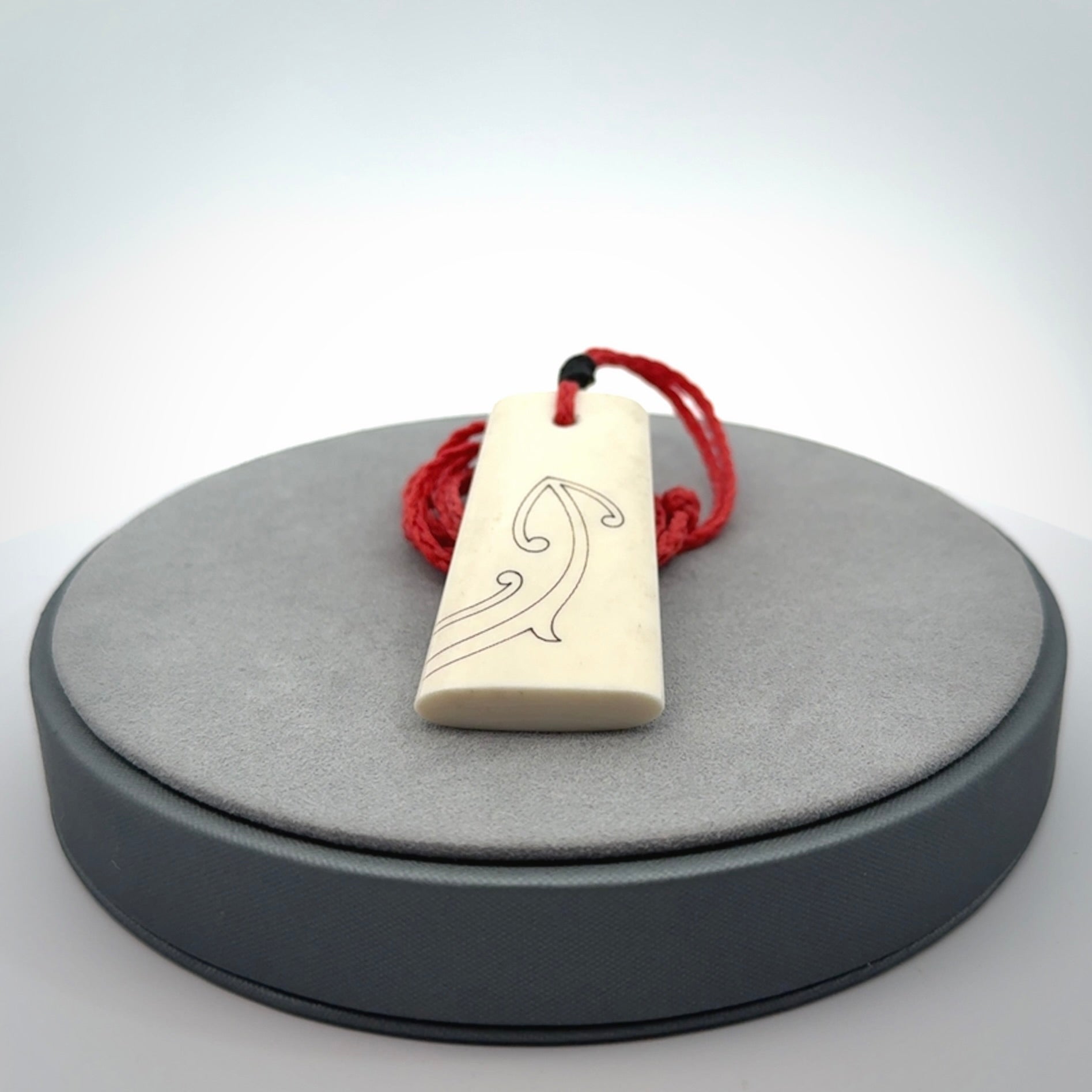 Hand carved bone toki pendant