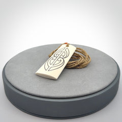 Hand carved bone toki pendant