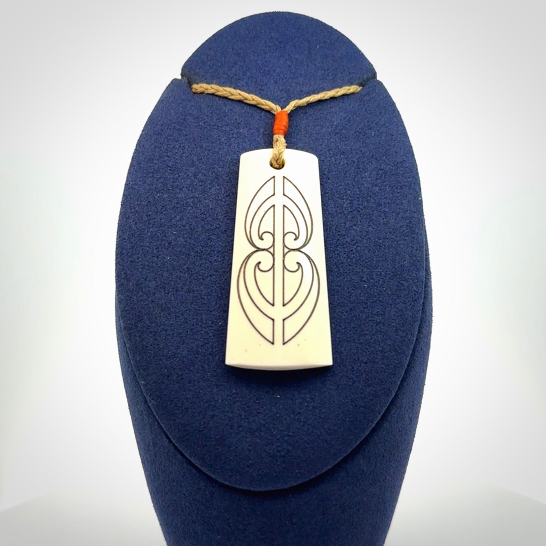 Hand carved bone toki pendant