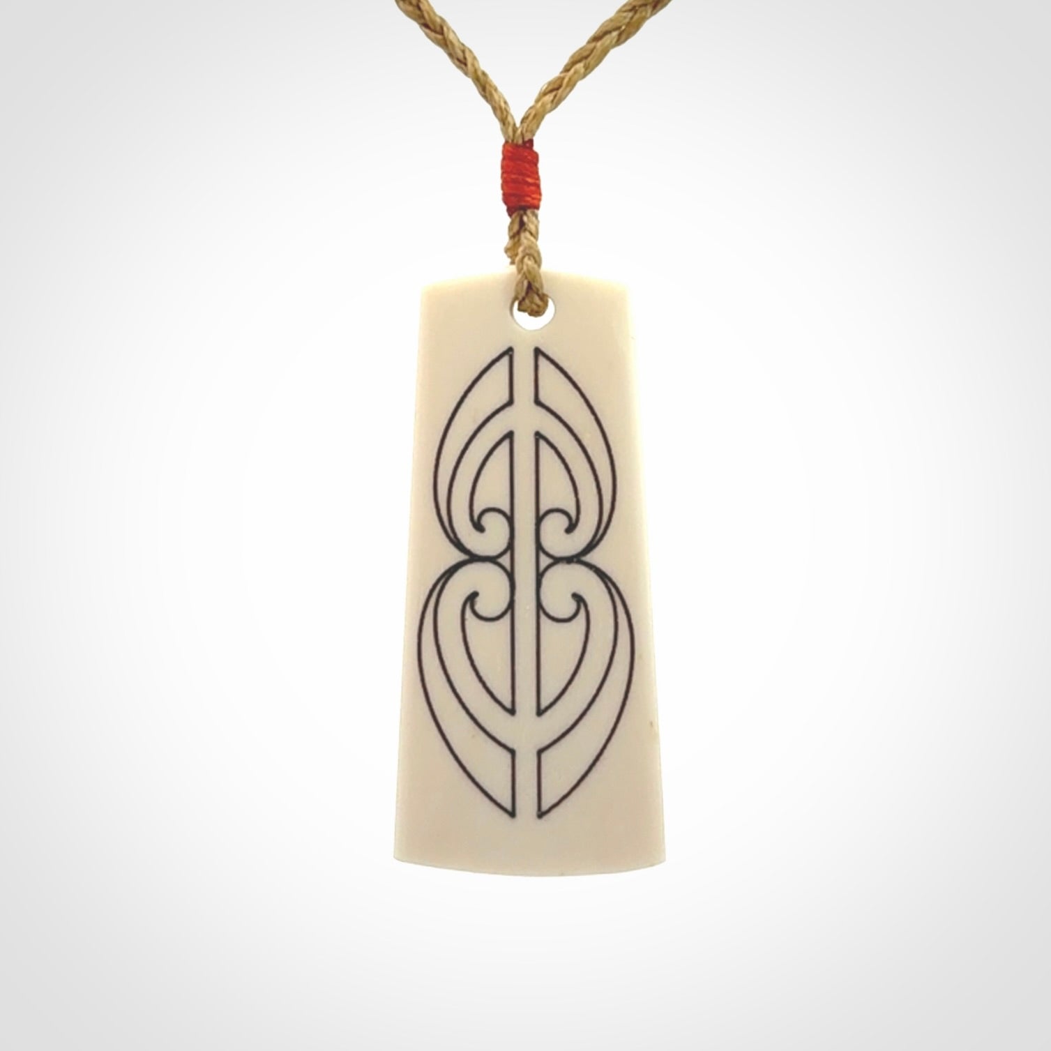 Hand carved bone toki pendant