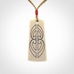 Hand carved bone toki pendant