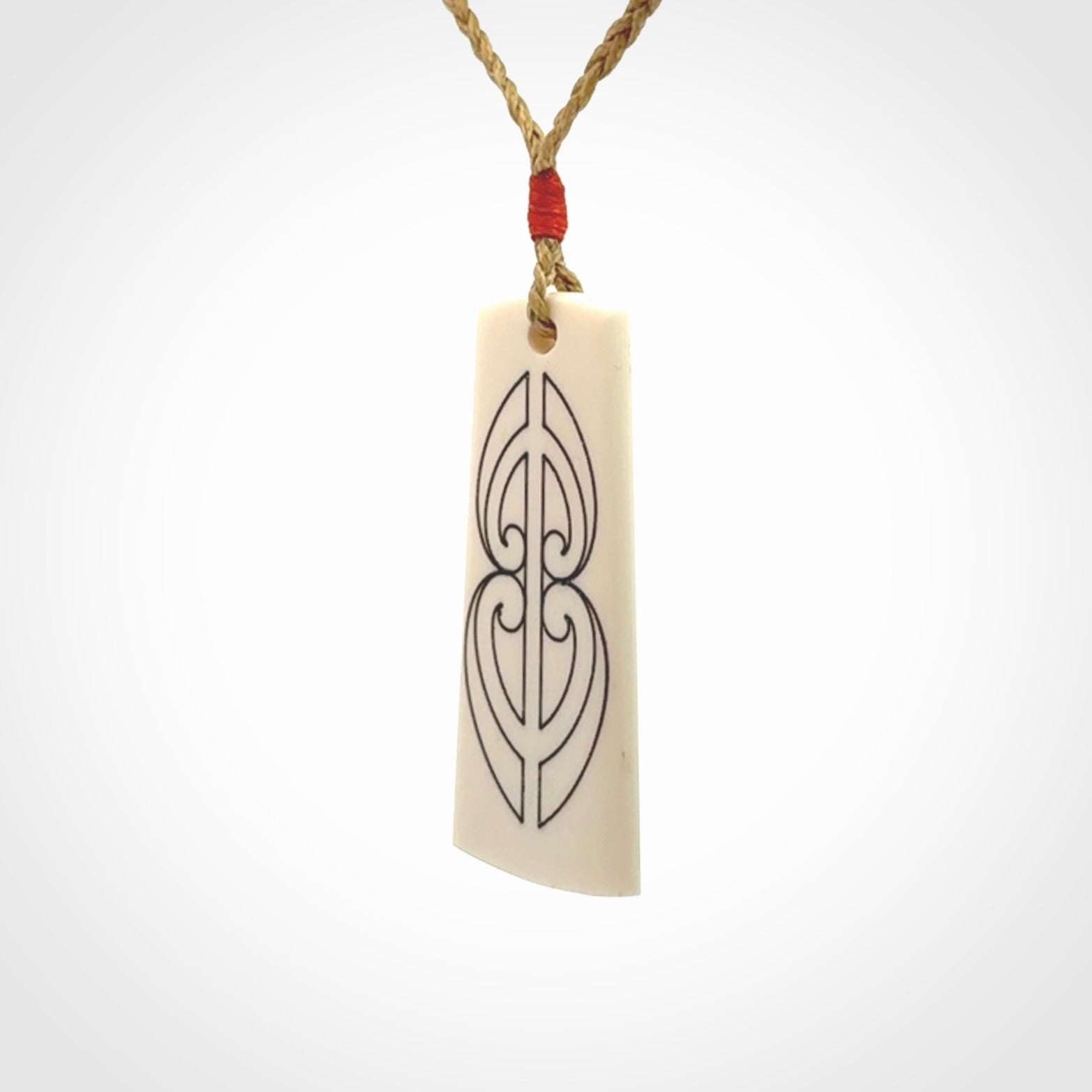 Hand carved bone toki pendant