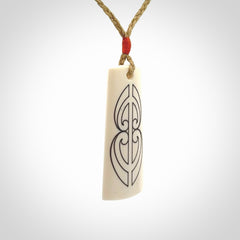 Hand carved bone toki pendant