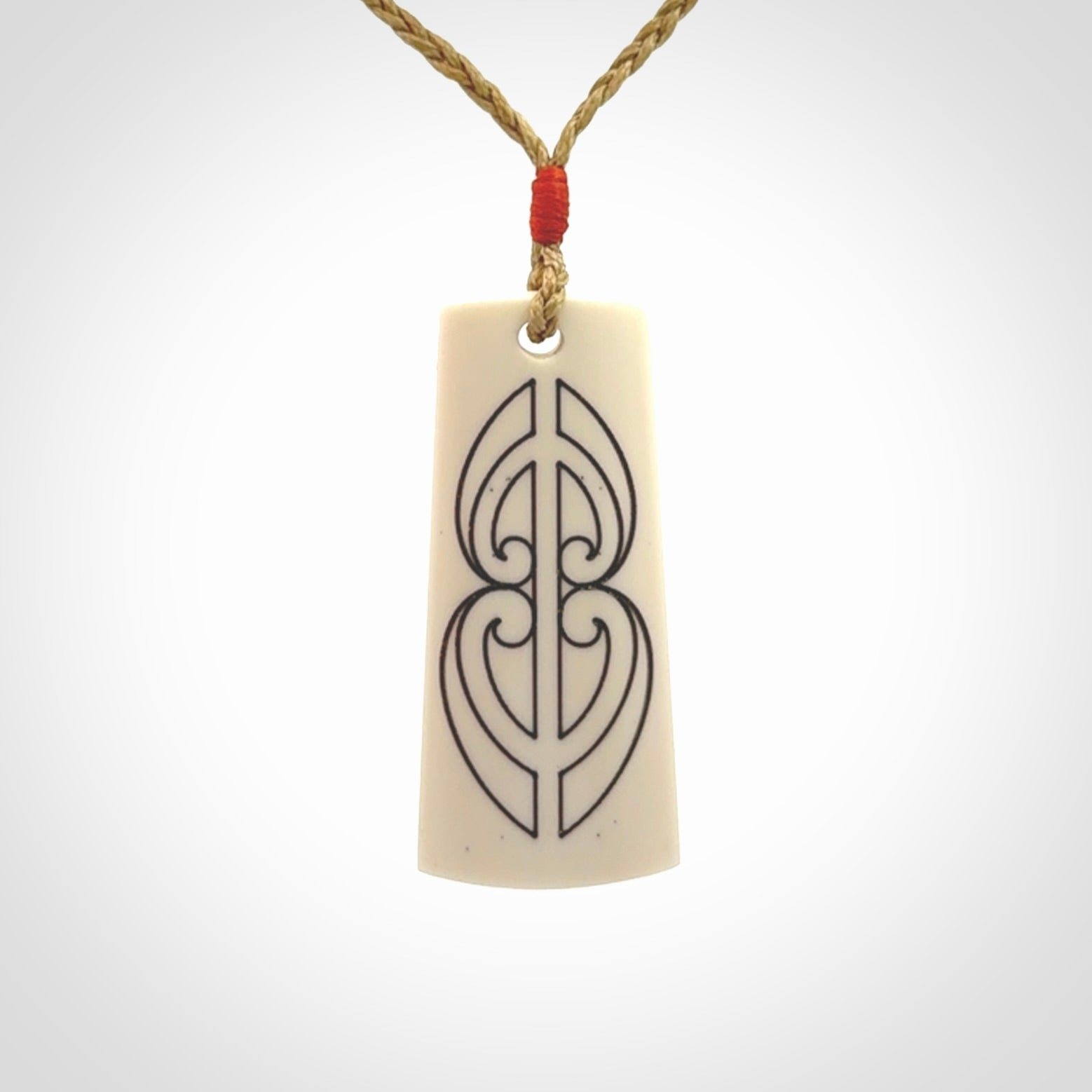 Hand carved bone toki pendant