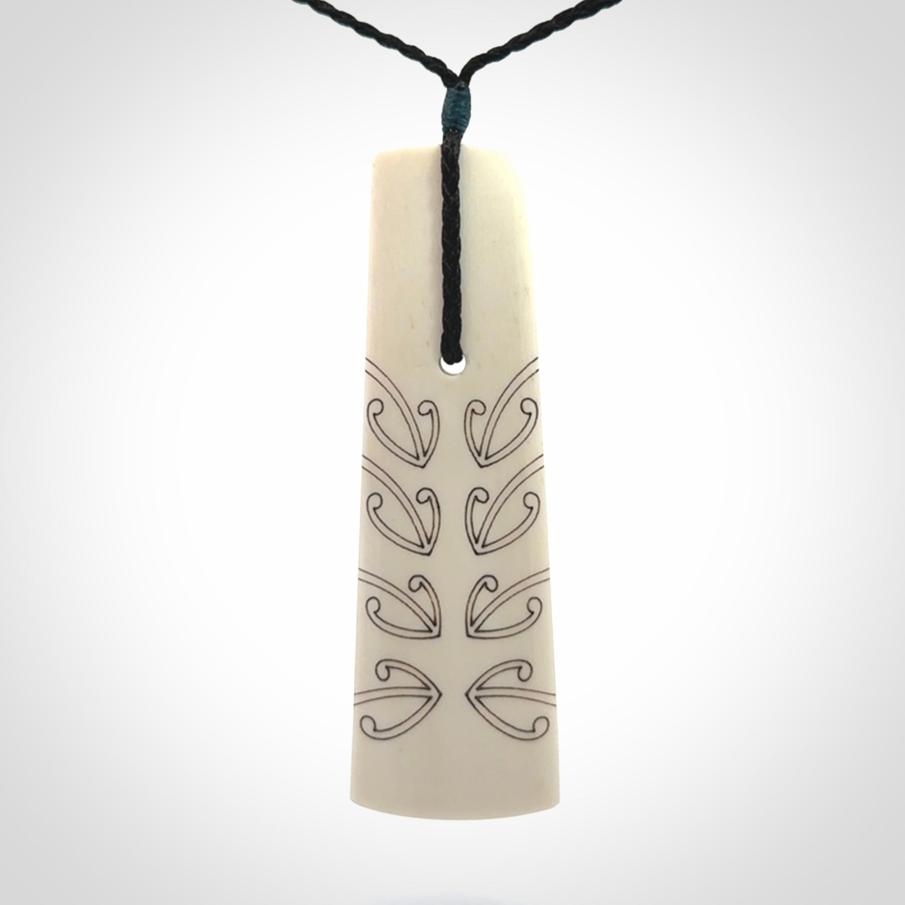 Hand carved bone toki pendant
