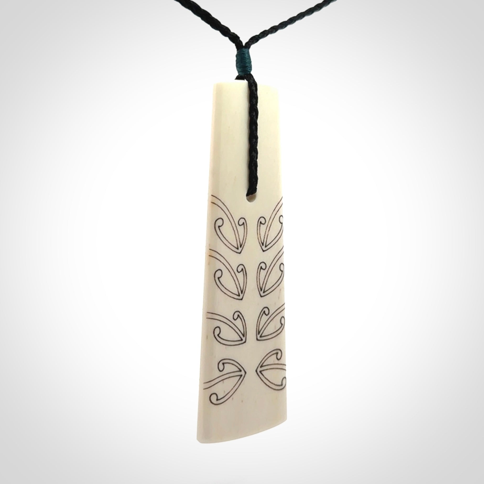 Hand carved bone toki pendant