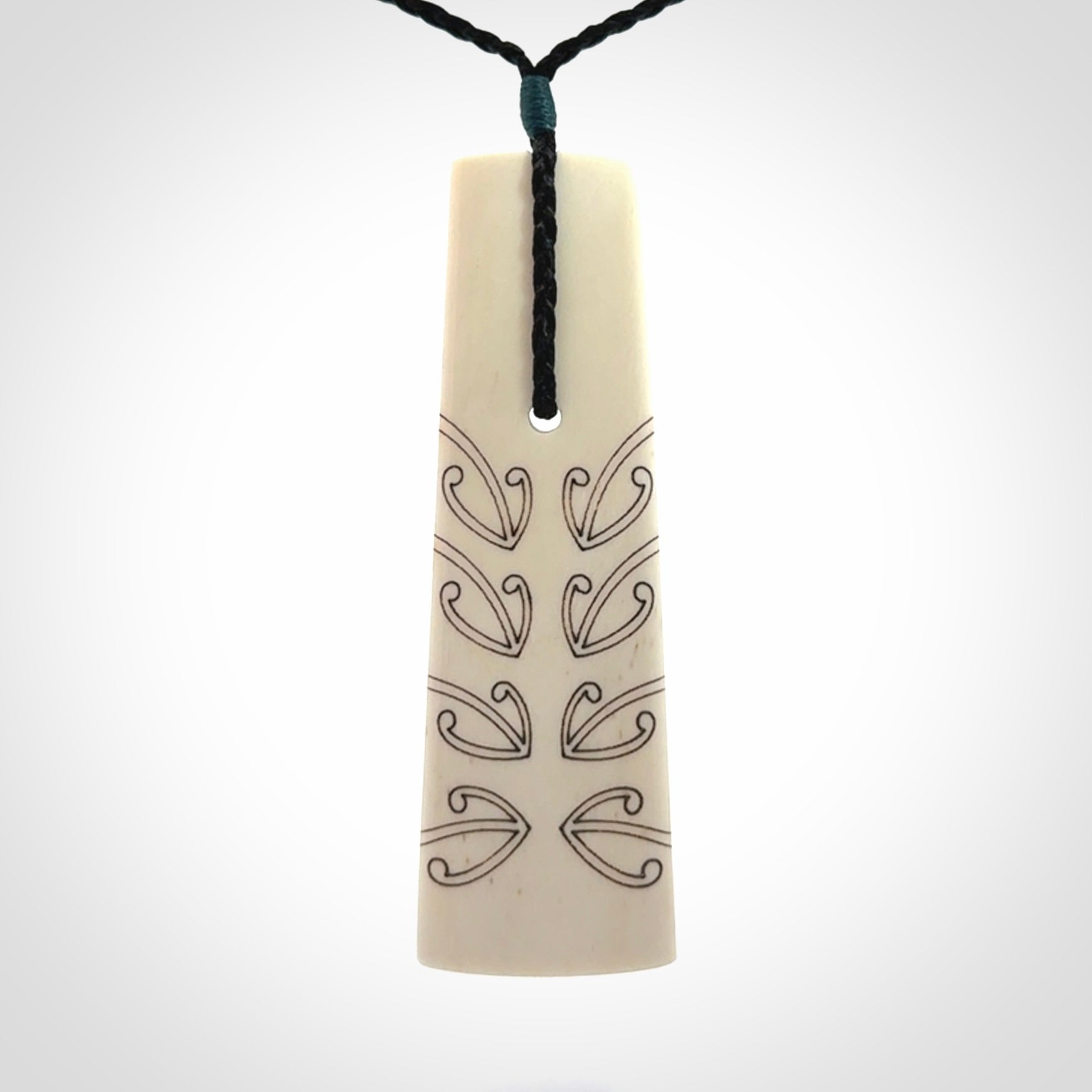Hand carved bone toki pendant