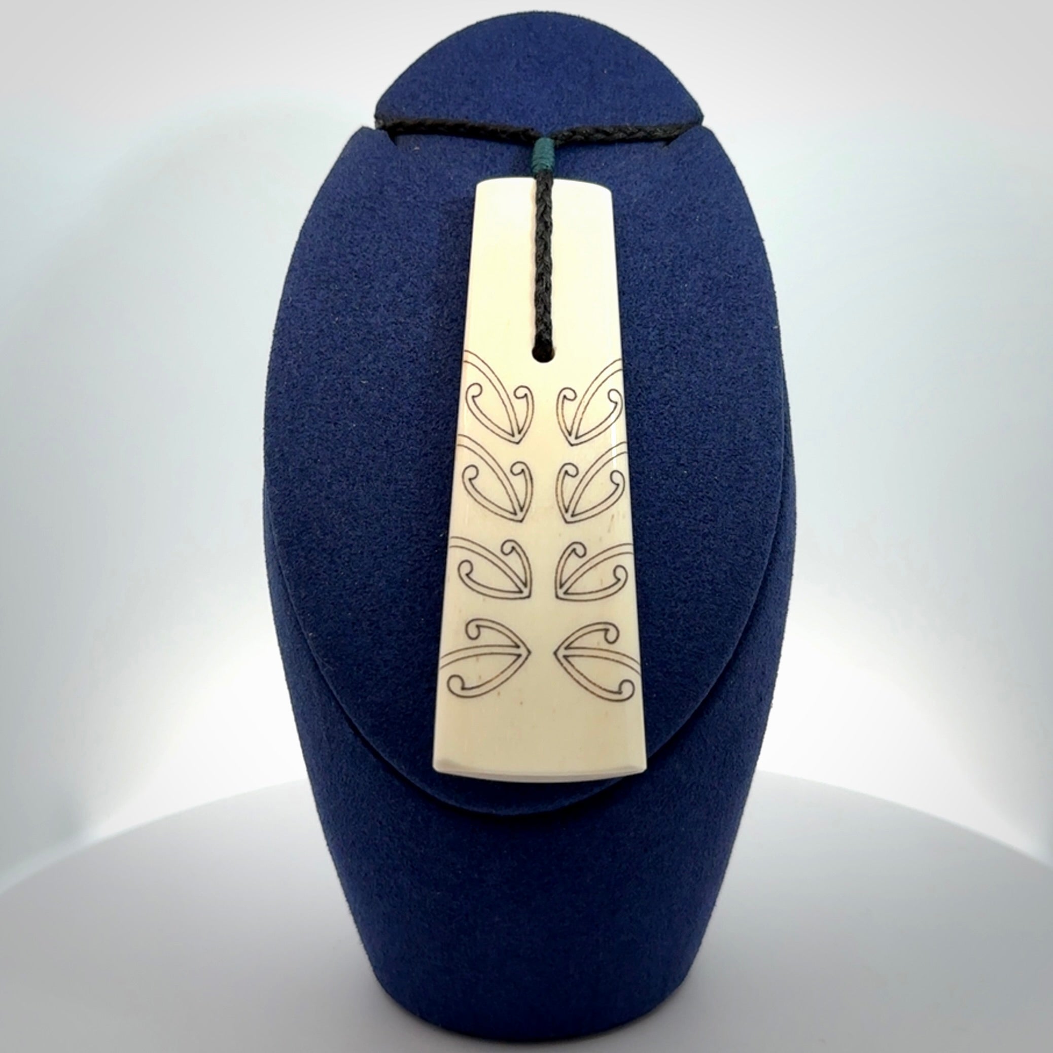Hand carved bone toki pendant
