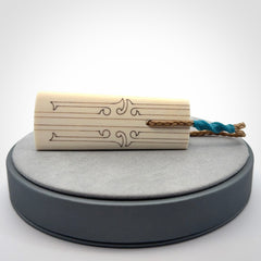 Hand carved bone toki pendant