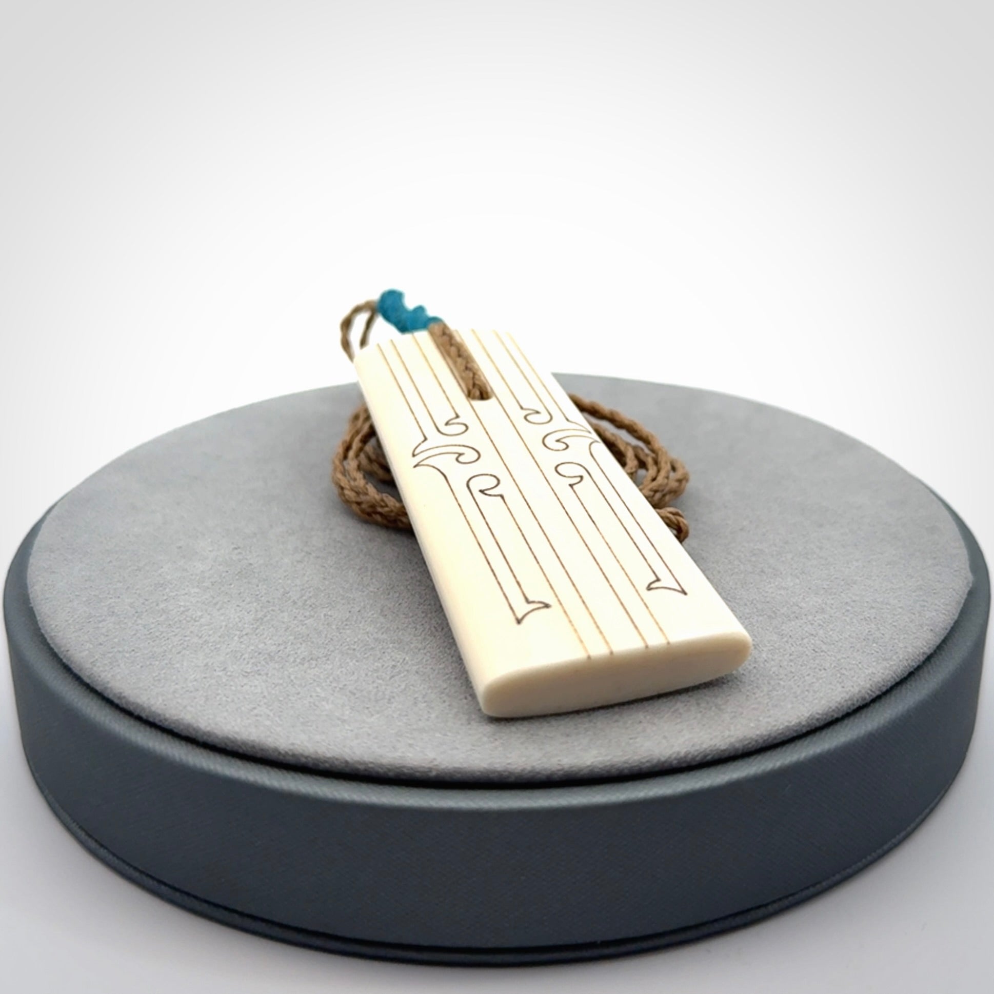 Hand carved bone toki pendant