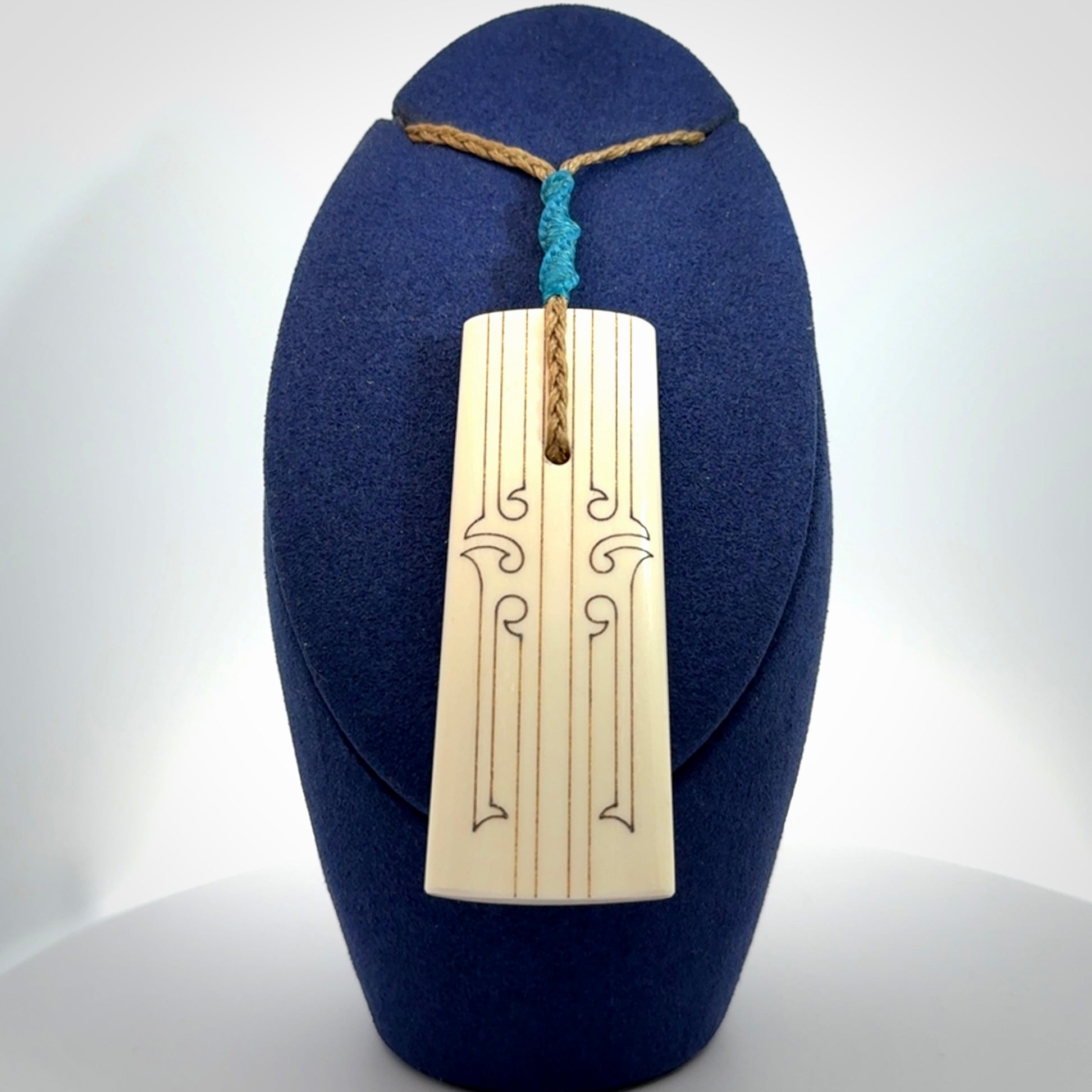 Hand carved bone toki pendant