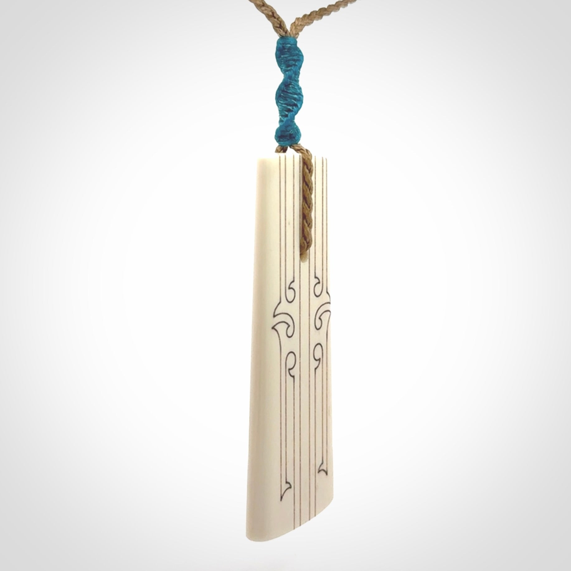 Hand carved bone toki pendant