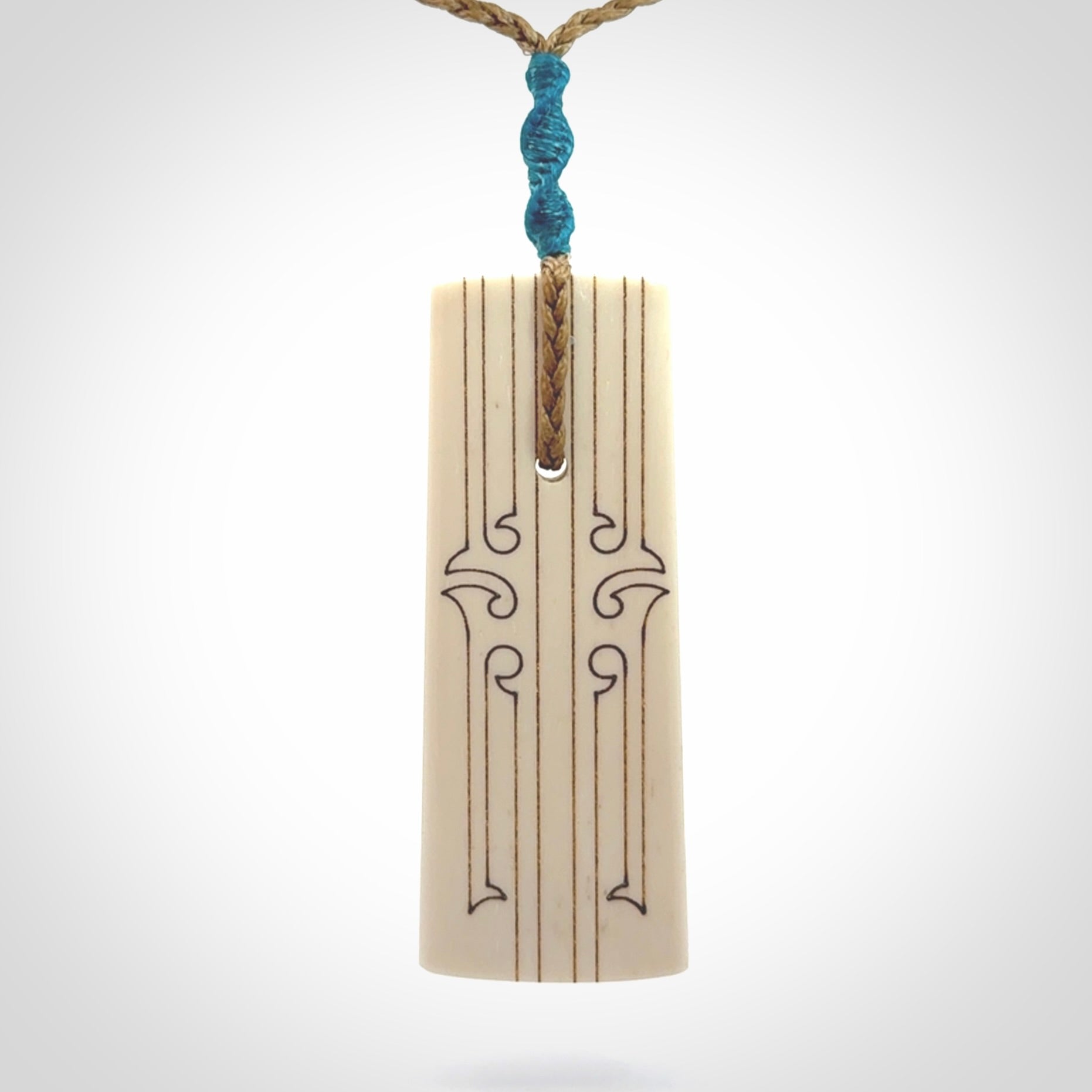 Hand carved bone toki pendant