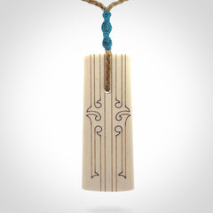 Hand carved bone toki pendant