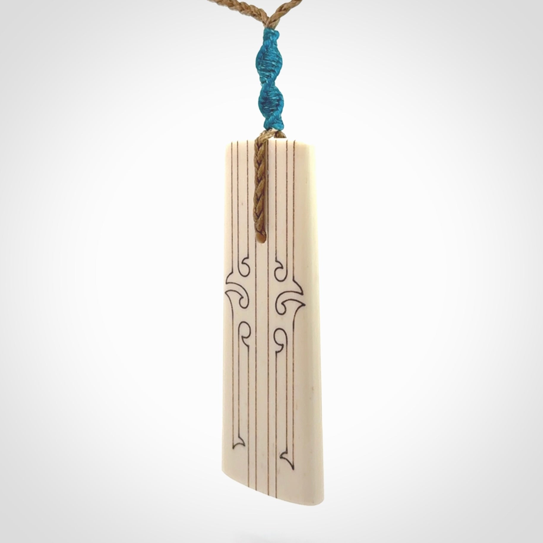 Hand carved bone toki pendant