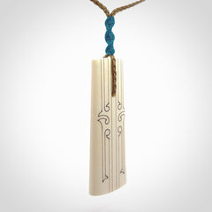 Hand carved bone toki pendant