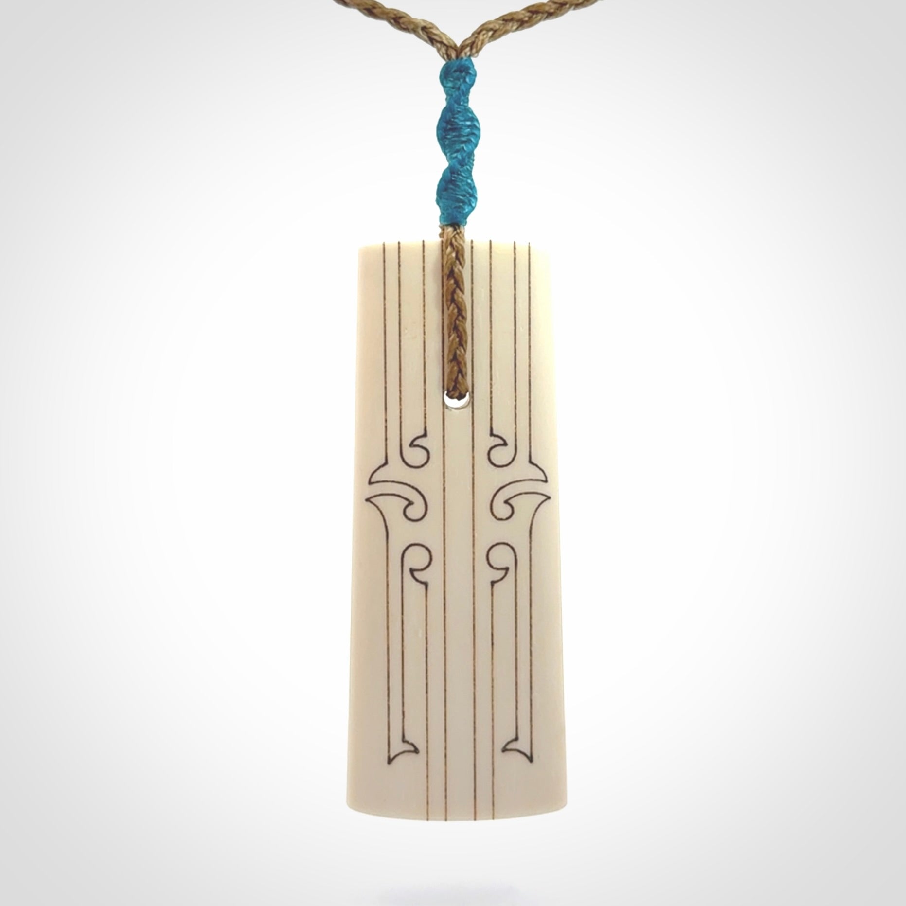Hand carved bone toki pendant