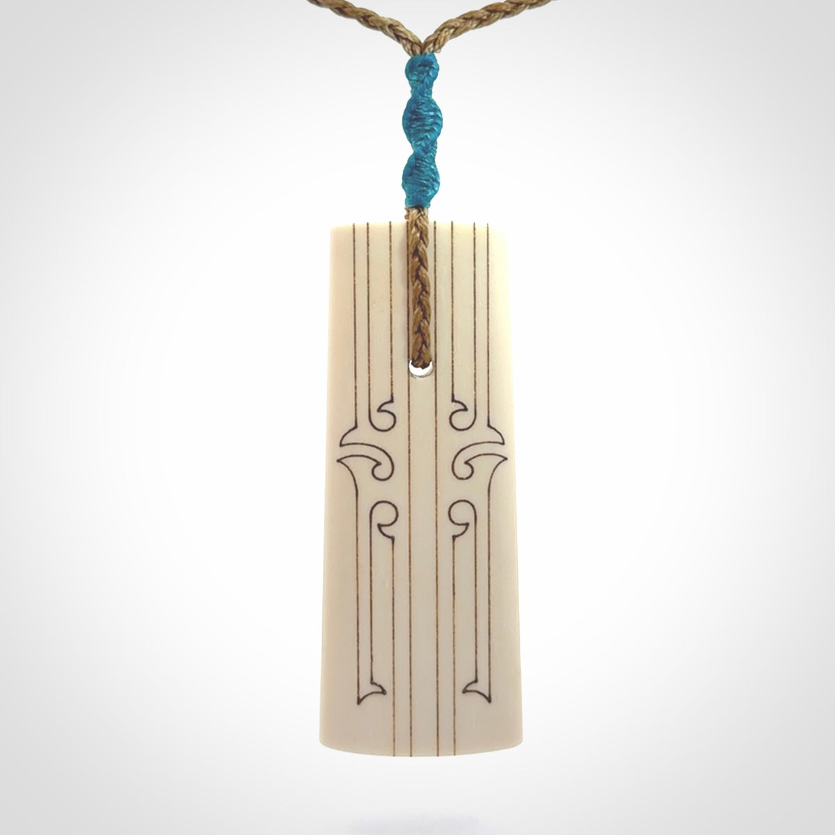 Hand carved bone toki pendant