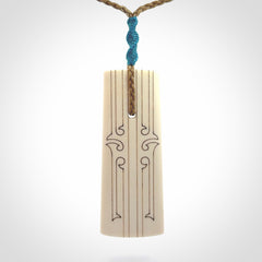 Hand carved bone toki pendant
