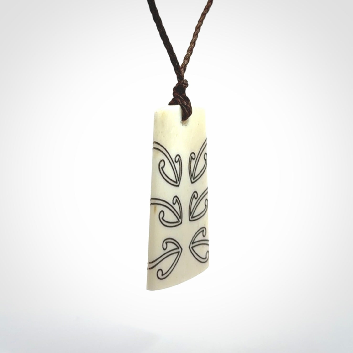 Hand carved bone toki pendant