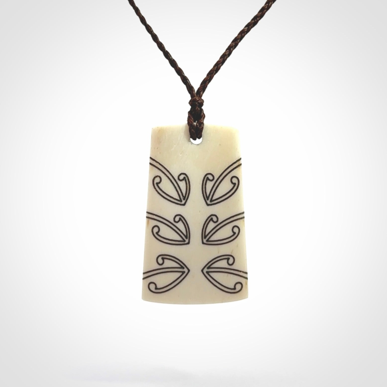 Hand carved bone toki pendant