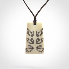 Hand carved bone toki pendant