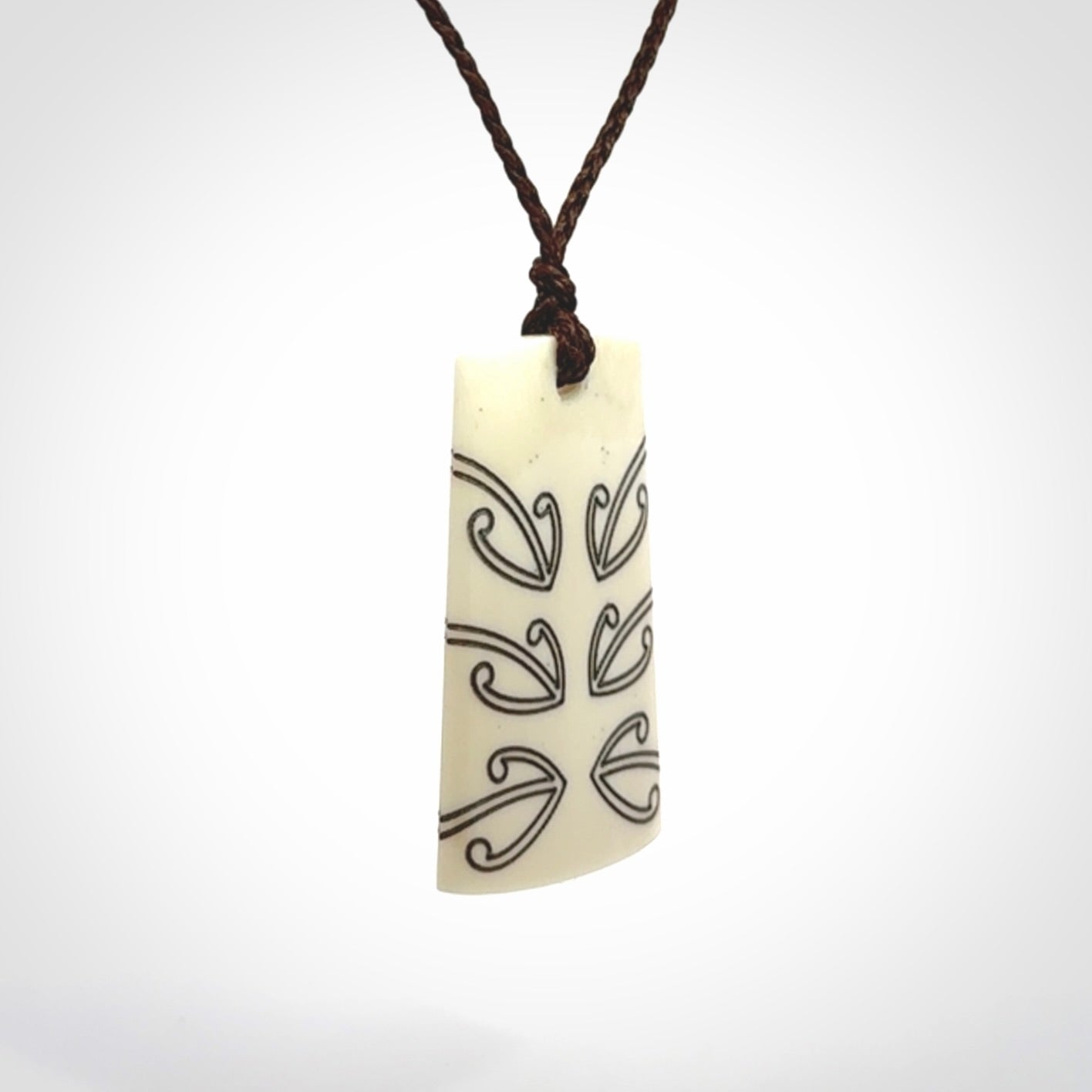 Hand carved bone toki pendant